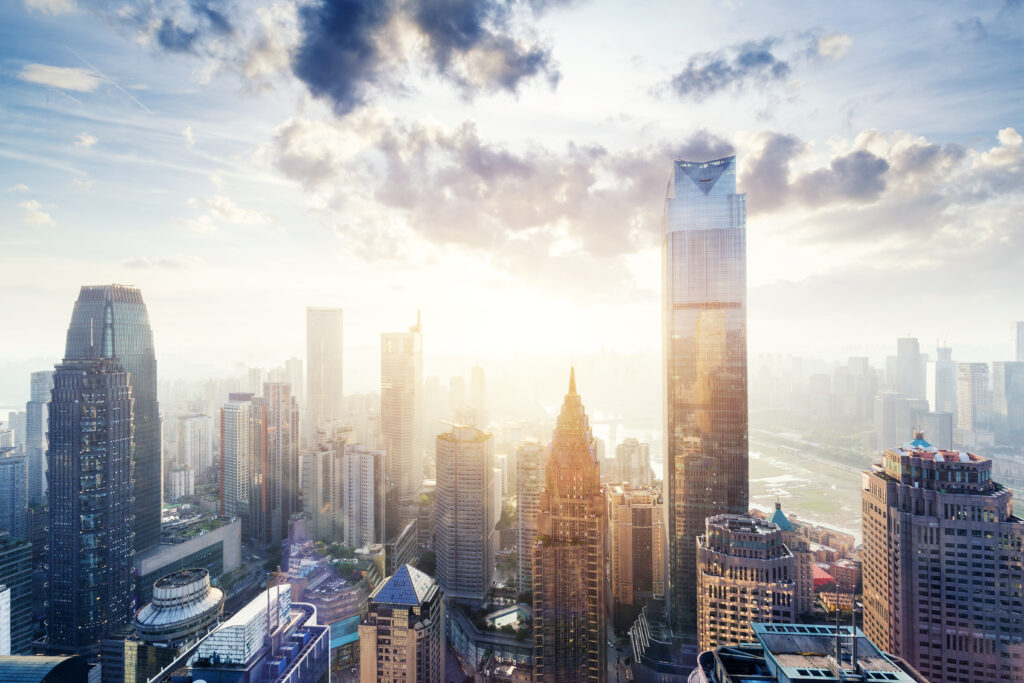 modern abstract buildings in midtown of chongqing with sunbeam in cloud sky